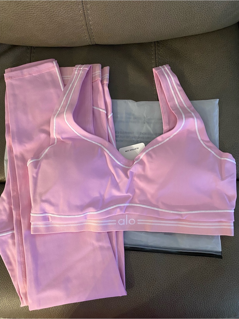 ALO Yoga Candy Heart Pink Sports Bra and leggings with Subtle White Trim